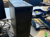 a desktop computer sitting on a desk in front of a computer monitor