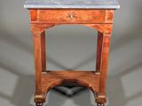 a small table with a marble top and wooden legs