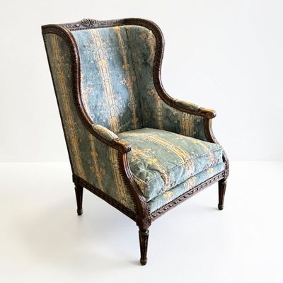 an image of a chair with a blue and green upholstered upholstered seat