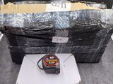 a stack of boxes and a box with a tape measure on it