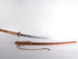 a sword that is laying on a table