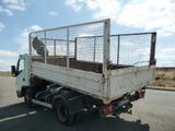 a white truck with a cage on the back of it