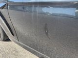 a close up of a car ' s door handle and door handle