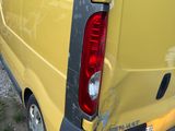 a yellow van that is parked on the side of the road