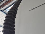 a very tall antelope that is hanging from the ceiling