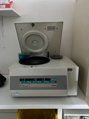 a record player sitting on top of a white shelf