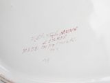 a close up of a plate with writing on it