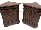 pair of antique carved wood side tables with figures on them