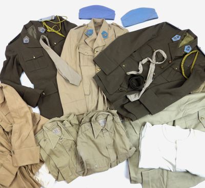 a lot of clothes that are laid out on the floor