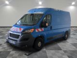 a picture of a blue van parked in a garage