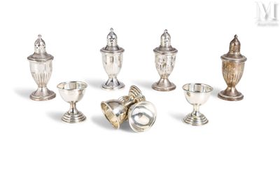 seven silver vases and two silver cups on a white background