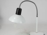 an image of a white desk lamp on a white table