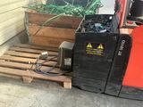a stack of pallets and a forklift sitting on a pallet