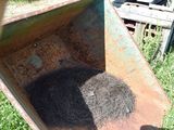 a small pile of grass inside of a wheelbarrow