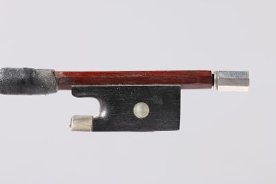 violin bow made of wood and metal on a white background