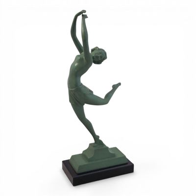 statue of a woman holding a tennis racquet on a marble base