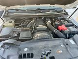 a car engine with its hood open and the hood down