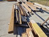 many pieces of wood on the ground next to each other