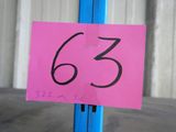 a pink sign on a blue pole with a number on it