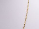 a gold chain necklace with a heart pendant on a mannequin mannequin mannequin mannequin mannequin mannequin mannequin mann