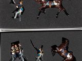 quatre figurines représentant un homme à cheval, dans une boîte