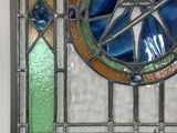 a stained glass window with a star in it