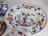 two plates and a bowl sitting on a table