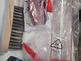 the contents of a hair brush, brush, and other items are wrapped in plastic