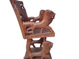 an image of a wooden chair with a dog on it