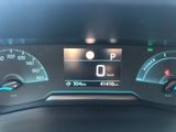 the dashboard of a car with a digital display on it