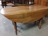 a wooden table that is sitting in the middle of a room