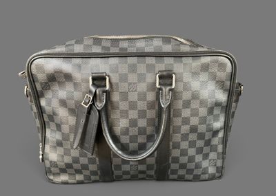 an image of a louis vuitton bag on a grey background