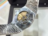 a close up of a watch with a gold face