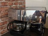 a coffee machine sitting on a counter in a kitchen