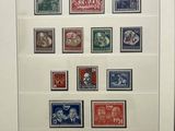 an old picture of a picture of a collection of stamps on display