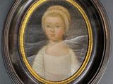 portrait of a young girl in a white dress in a black frame