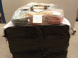 a stack of bags of food on a cart in the middle of a room