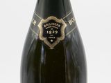 bottles of champagne are lined up on a white surface