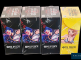three boxes of one piece card game sitting next to each other