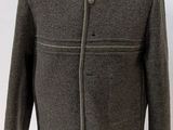 grey wool jacket on a mannequin stand
