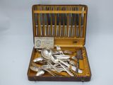 silverware in a wooden case with silverware in it