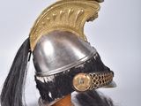 a helmet with a long black hair and a red mohawk