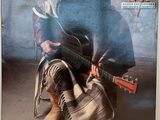 une vieille photo d'un homme assis par terre avec une guitare