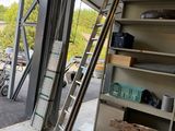 a ladder leaning up against a wall in a garage