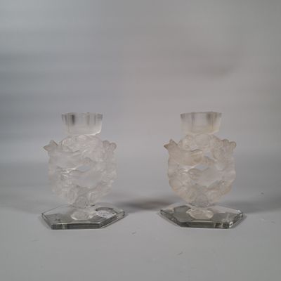 two clear vases sitting on top of each other