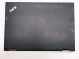 a black laptop that is sitting on a white surface