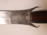 a knife that is laying on a table
