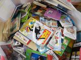 a large bag full of children ' s books on the floor