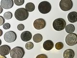 a lot of coins that are on the table