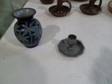 many different vases on display on the table